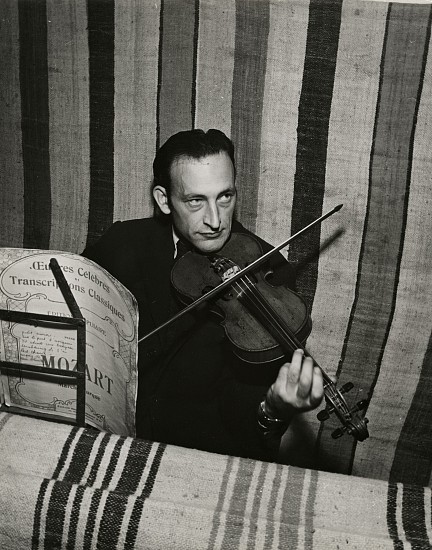 Eliot Elisofon, Concentration Camp in French Morocco, 1942
Vintage gelatin silver print, 9 1/4 x 7 3/8 in. (23.5 x 18.7 cm)
Gustav Schmiliver - Russian Jew - diamond cutter, learned violin in camp.
(Sold as part of a group of 18 prints)
6118