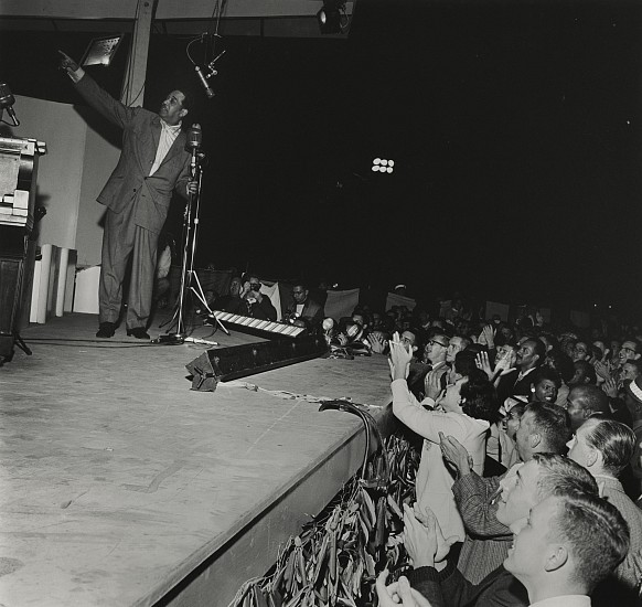 Paul J. Hoeffler, Duke Ellington at Newport Jazz Festival, 1956
Gelatin silver print; printed later, 11 x 14 in. (27.9 x 35.6 cm)
An image taken at Duke Ellington's legendary closing concert at the 1956 Newport Jazz Festival - which revamped Ellington's reputation and fortune for the rest of his life. That year's Festival was the first that Hoeffler photographed. Signed by the photographer.
7386
$400