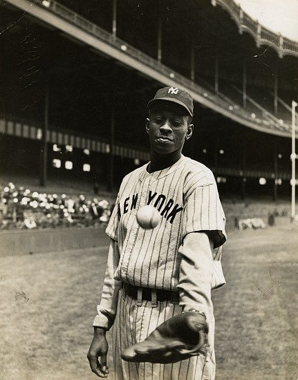 George Strock, Satchel warms up before the game. His uniform resembles the Yankees' outfit, 1941
Vintage gelatin silver print, 13 7/16 x 10 1/2 in. (34.1 x 26.7 cm)
Mounted on board; annotated in ink and stamped and dated by Time and LIFE on mount verso. (Similar stamps and annotations probably on print verso but only a fraction can be seen because of print lifting off mount at bottom.)
Illustrated: Life, June 2, 1941, p. 90 [using this print].
8498